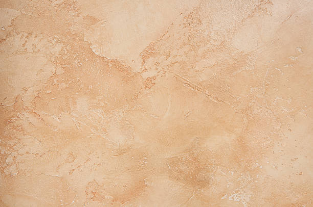 A tan, marble, vintage background background textured. adobe material photos stock pictures, royalty-free photos & images