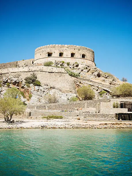 Crete Spinalonga Fortress on small Kalidonia Island (Spinalonga Island) . The venetian fortress built approx. in the 16th century was used as the last active leprosy colony to quarantaine leprous people until 1957. Crete. Greece Photo Collection