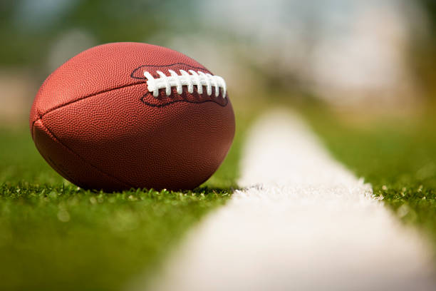 istock American football on the turf 157442085