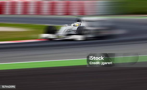 An Openwheel Race Car In Motion Stock Photo - Download Image Now - Racecar, Speed, Stock Car