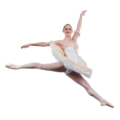 A ballerina displays a graceful jump.