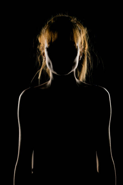 istock Silhouette of woman's head and shoulders 1574422275