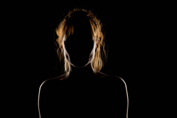 istock Silhouette of woman's head and shoulders 1574422279
