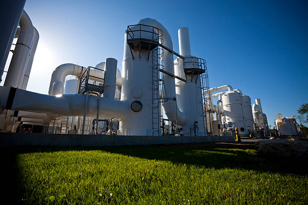 istock Low-angle shot of water purification plant, shadows on grass 157442569