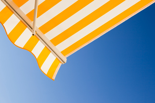 White beach umbrella isolated on white background with clipping path