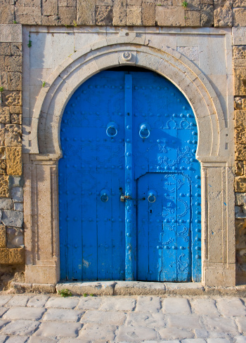 Wooden arched door with ivy in North Cyprus