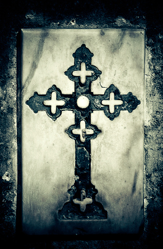marble cross in a graveyard, sevilla cathedral - spain