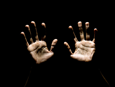 afro caribbean male hands raised to heaven in a pray  (this picture has been taken with a Hasselblad H3D II 31 megapixels camera)