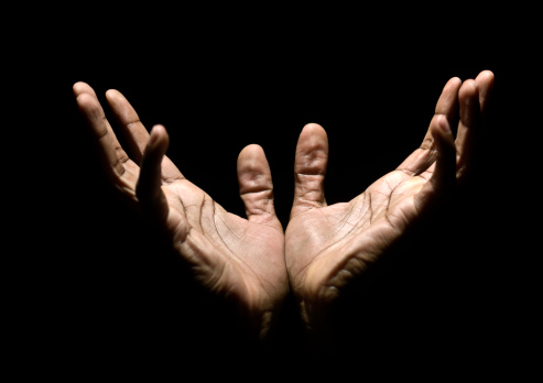 afro caribbean male hands raised to heaven imploring mercy  (this picture has been taken with a Hasselblad H3D II 31 megapixels camera)
