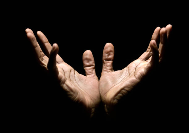Hands to Heaven afro caribbean male hands raised to heaven imploring mercy (this picture has been taken with a Hasselblad H3D II 31 megapixels camera) black gospel church stock pictures, royalty-free photos & images
