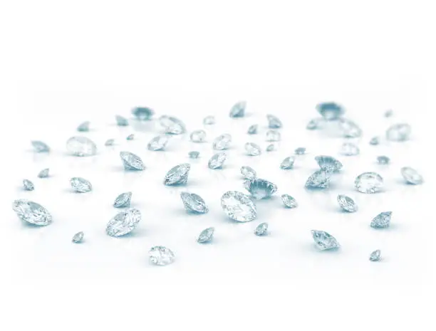 Diamonds scattered on shiny white background
