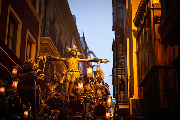 christ procression christ procession at twilight during semana santa in sevilla holy week photos stock pictures, royalty-free photos & images
