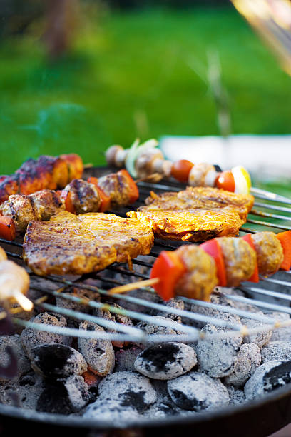 istock Skewer and meat on a grill 157444162