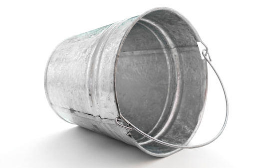 galvanized metal pail tipped on side