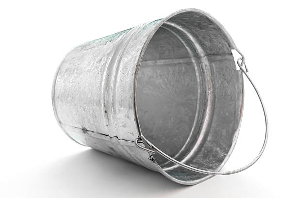 galvanized metal pail tipped on side stock photo