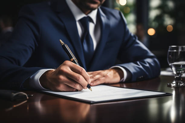Close up of businessman signing a contract
