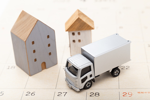 A calendar, a house object and a cargo truck.