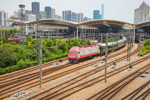 A low-speed passenger train departs from Shanghai Railway Station