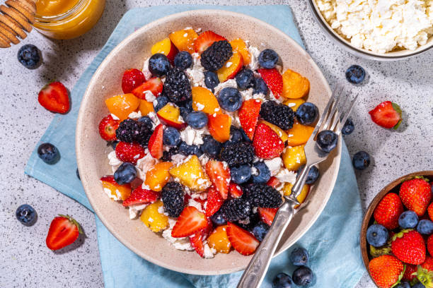 istock Summer fruit and berry salad with cottage cheese 1574471793