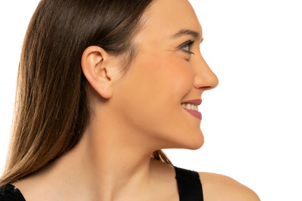 istock Profile of a young beautiful happy woman with makeup 1574475062