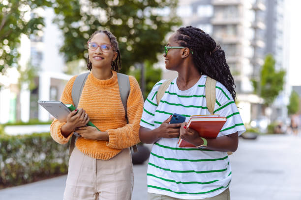 istock Two young African American female students walking to class 1574544629
