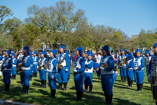 Davis, CA. Picnic Day parade at the University of California at Davis featuring Falun Dafa band in blue uniforms