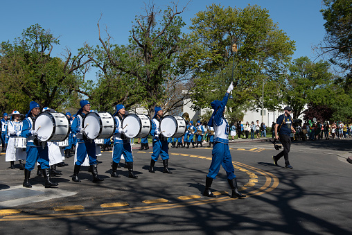 Davis, CA. Picnic Day parade at the University of California at Davis featuring Falun Dafa band in blue uniforms