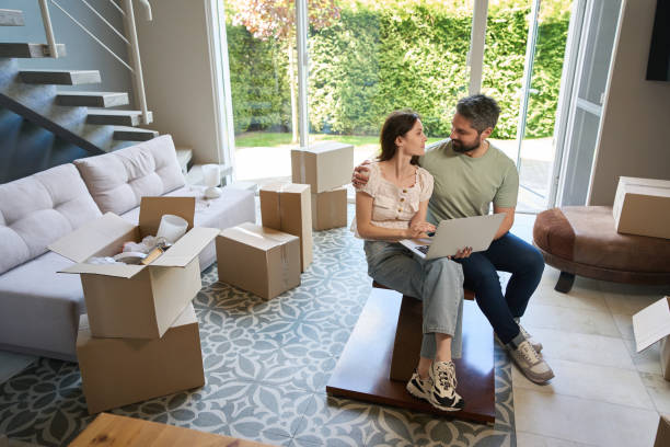 istock Couple in love spending time together in modern room 1574561928