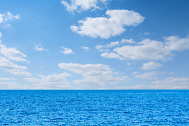 istock Blue sea and white clouds on sky. Water cloud horizon background Feeling calm, cool, relaxing, ocean 1574591126