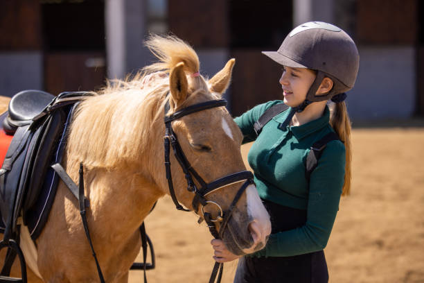 istock Girl with her horse 1574598193