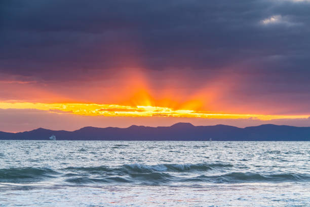 istock Sunset over the Ocean with Mountains in the Background, Tunisia 1574626488