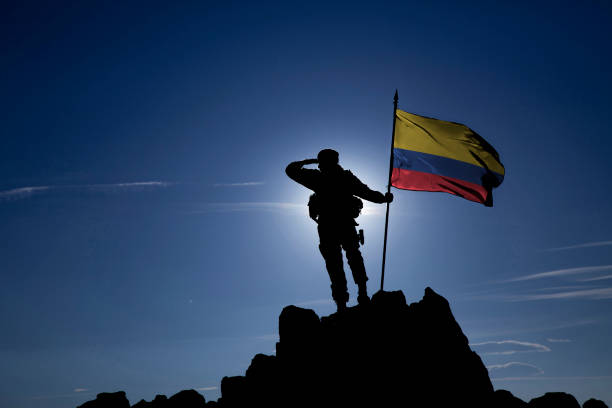 Soldier on top of the mountain with the Colombian flag stock photo
