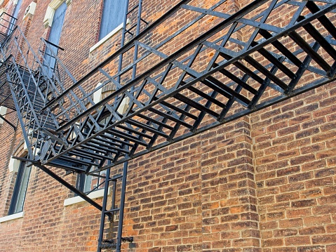 Iron fire escape along red brick building in downtown Greenville, Ohio.