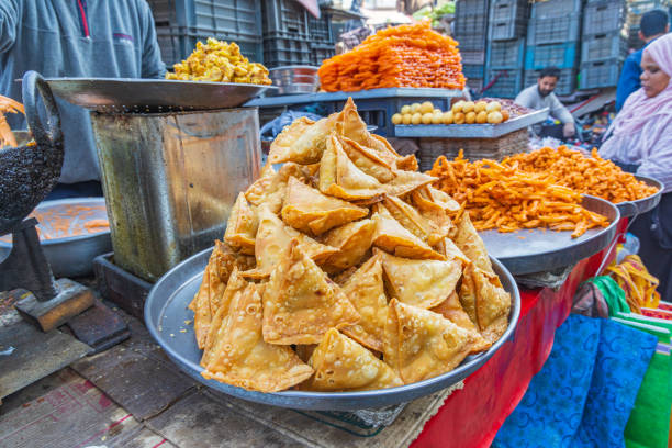 Fried snack food for sale at a market in a village of Jammu and Kashmir. Berna Bugh, Kangan, Jammu and Kashmir, India. October 27, 2022. Fried snack food for sale at a market in a village of Jammu and Kashmir. samosa shop stock pictures, royalty-free photos & images