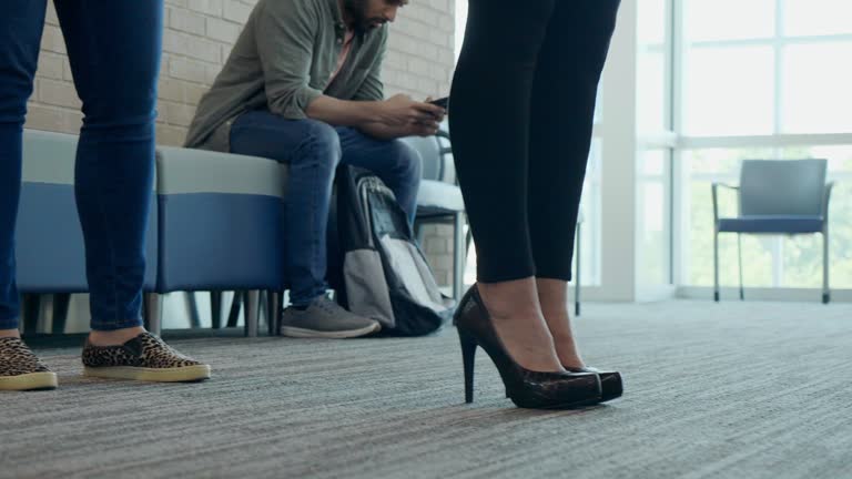 Unrecognizable people waiting in line at bank branch