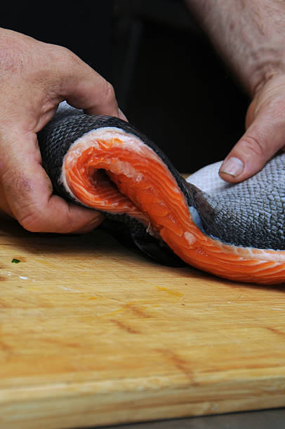 istock Fresh salmon fish on wooden cooking desk 157473173