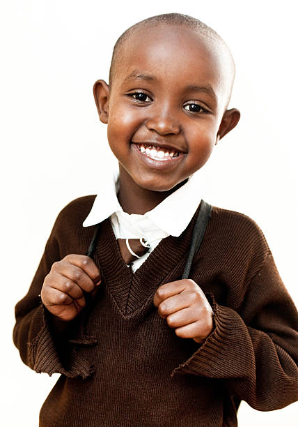 アフリカのスクールボーイ白背景 - child 6 7 years education school ストックフォトと画像