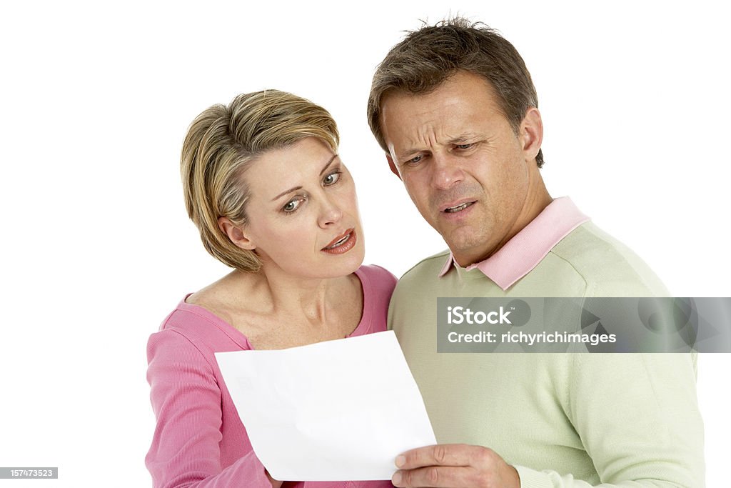 Couple worrying about letter  Studio Shot Stock Photo