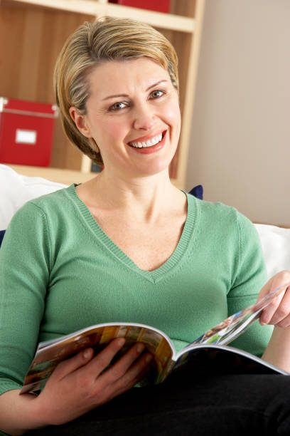 istock Woman Relaxing With Magazine 157473530