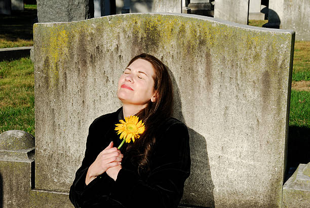 Grieving Woman With Yellow Flower stock photo