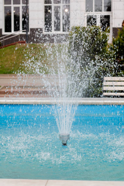 istock photo of water falling down from a small fountain. 1574740141