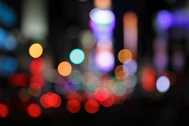 ny times square - defocused light dots multi colored stock photo
