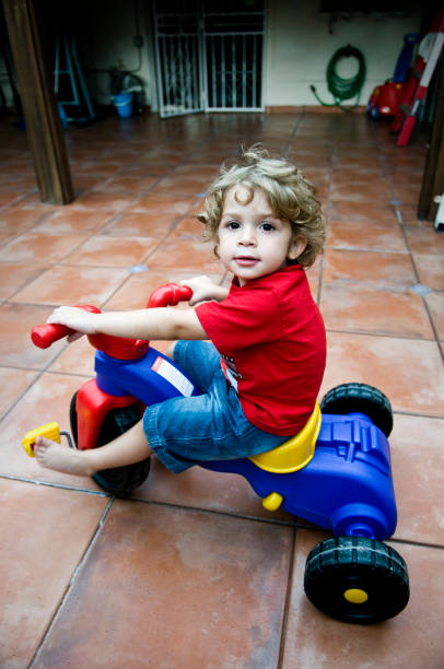 Toy scooter model close up on yellow background