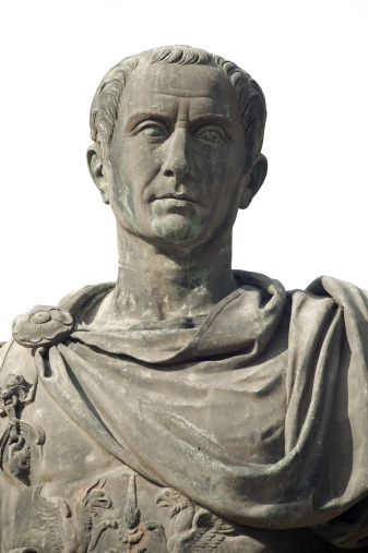 Italy, Rome (fori imperiali): statue of Gaius Julius Caesar (13 July 100 BC – 15 March 44 BC), was a Roman military and political leader. He played a crucial role in the transformation of the Roman Republic into the Roman Empire.