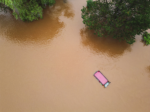 A car has been lost in floodwater after record breaking rainfall.