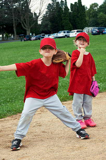 istock Boy and Girl Play Baseball 157475414