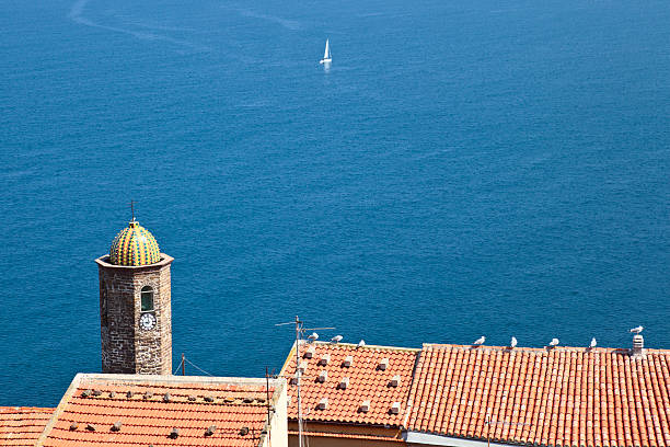Mediterranean scene. Clocktower in Castelsardo (Sardinia, Italy) Clocktower in Castelsardo (Sardinia, Italy) castelsardo stock pictures, royalty-free photos & images