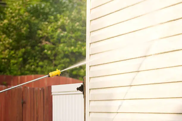 Photo of pressure washing a dirty house