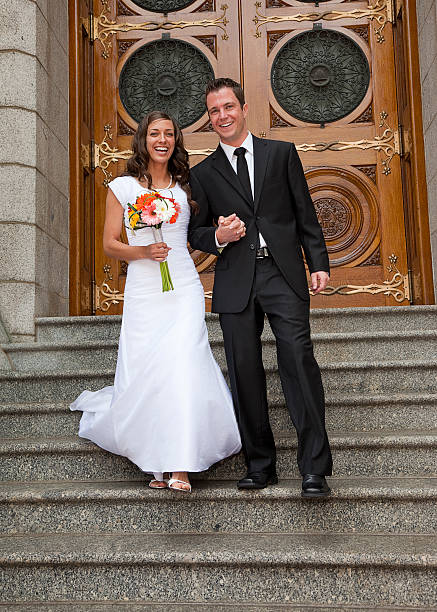 istock Bride and Groom Exiting Church 157475728