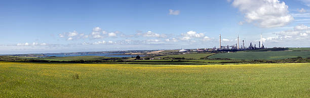 Panorama of oil refinery and coast Panorama of oil refinery and coast milford haven stock pictures, royalty-free photos & images